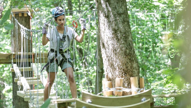 IndyStar reporter Alexa Goins tries out the nearly completed Koteewi Aerial Adventure Park & Tree Top Trails at Strawtown Koteewi Park in Noblesville.
