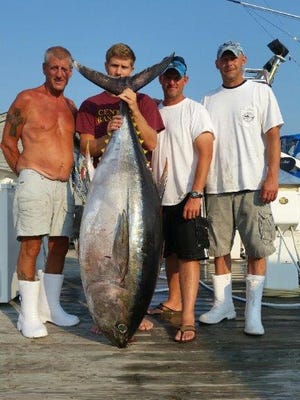 The crew of the Tuna Taker with a 220-pound bigeye tuna caught at the Hudson Canyon in the summer of 2015.