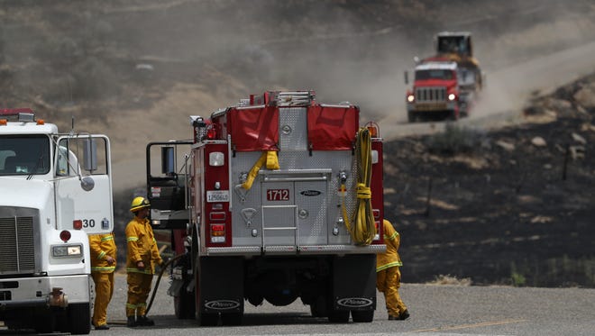 Firefighters on Friday battle the Klamathon Fire near the California-Oregon border.