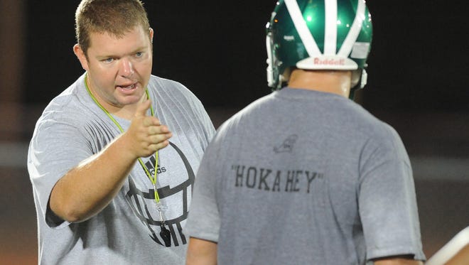 Chad Smith, left, Easley's coach from 2010-2012 and Clover's coach the past four years, has been hired to lead the Pickens football program.