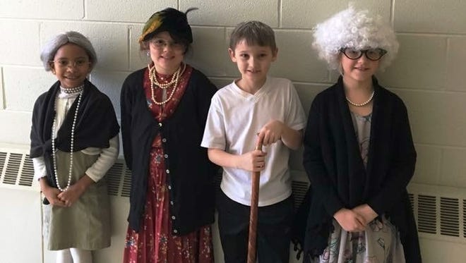 (From left) Kendal Holmes, Chloe Weyman, Hayden Wetzel and Dianna Sikora, second-graders at Cumberland Christian School in Vineland, dressed as 100-year-olds as part of their celebration of the 100th  day of school.