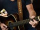 Charles Esten plays the guitar he uses on the television