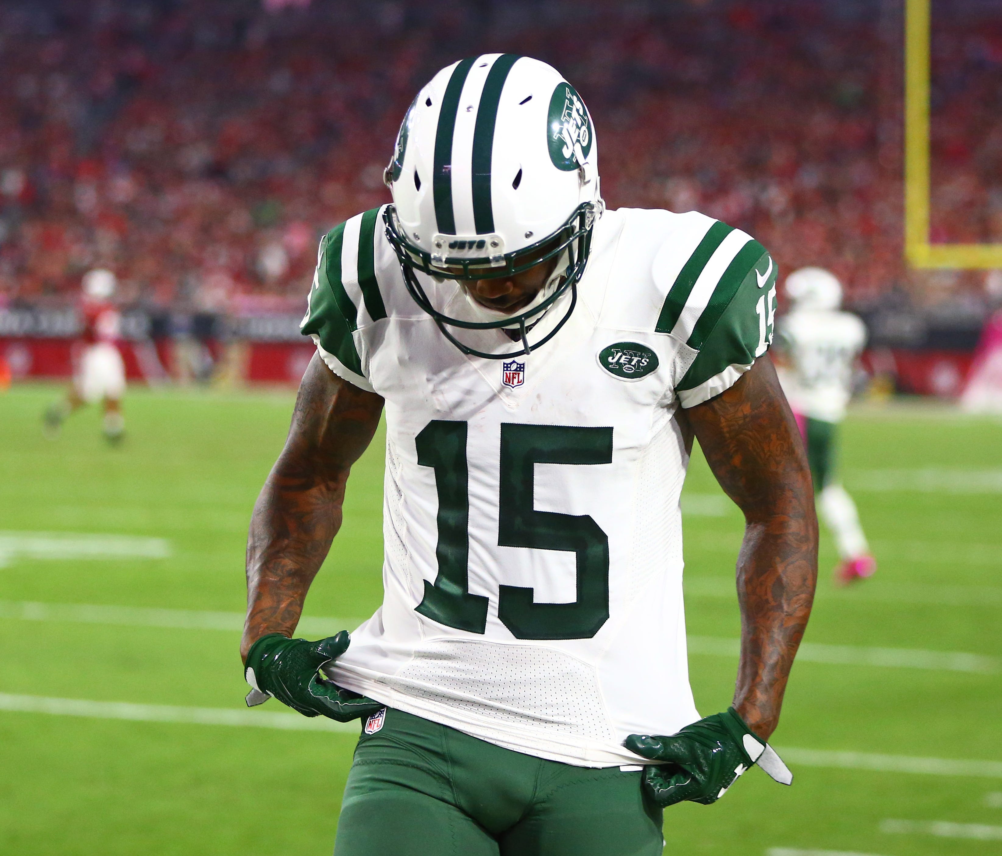 New York Jets wide receiver Brandon Marshall (15) reacts on the sidelines in the fourth quarter against the Arizona Cardinals at University of Phoenix Stadium.