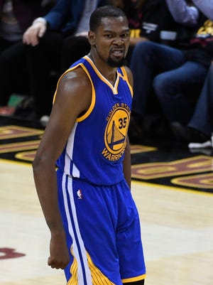 Kevin Durant (35) celebrates after making a three-point basket during the fourth quarter in Game 3 of the 2017 NBA Finals.