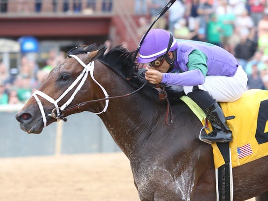 Magnum Moon winning the March 17 Rebel Stakes at Oaklawn