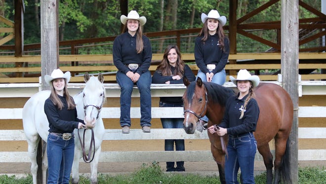 The South Kitsap co-op In Hand Obstacle Relay team includes, from left, Kallie Daviscourt from North Mason High School, with Mystique; Shawna Hettick, from Peninsula High School, coach Kayla Thomas; Carley Stratton, from South Kitsap High School; and Lillian Taylor, from Klahowya Secondary School, with Babe.