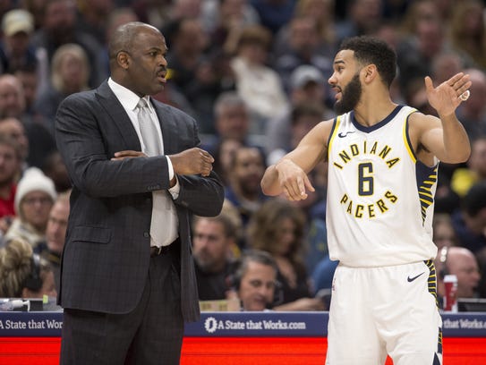 Pacers head coach Nate McMillan talks with Cory Joseph