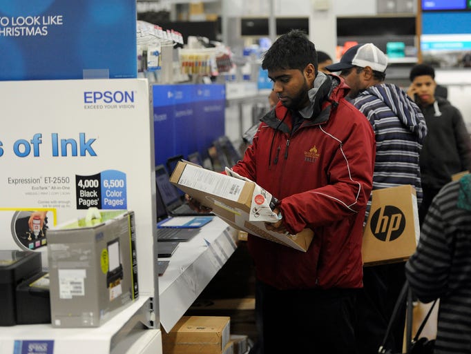 Shoppers look for Black Friday deals at Best Buy.