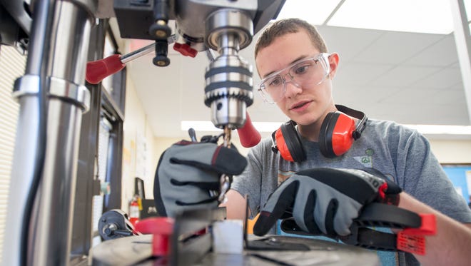 Jonah Thrasher, 16, works on a drill press during manufacturing class at Milton High School on Monday, December 4, 2017.  The Santa Rosa County School District would like to create an Innovation High School to prepare students for future work and careers in fields such as cybersecurity, IT, aerospace and engineering.