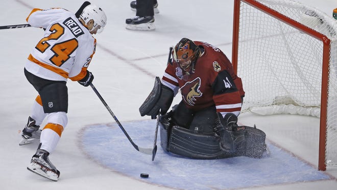 Flyers' Matt Read (24) shoots on Coyotes' Mike Smith (41) in the second period on opening night at Gila River Arena on October 15, 2016 in Glendale, Ariz.