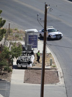 An El Paso police car rolled over Friday morning on Schuster Drive.