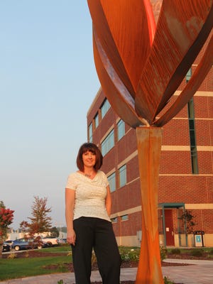 Kim Pigeon-Metzner helps match businesses with art.