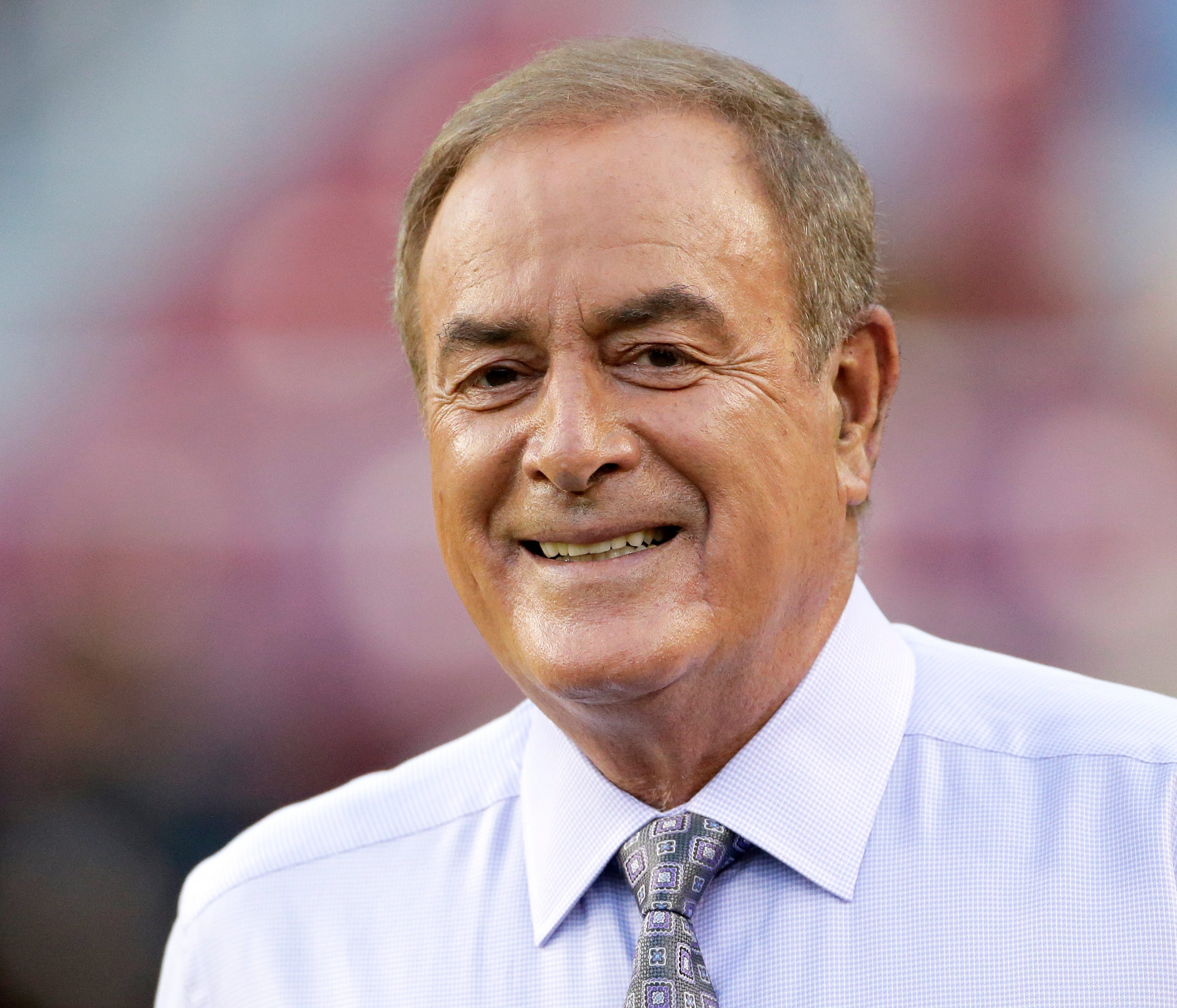 Al Michaels walks onto the field prior to an NFL football game between the Oakland Raiders and Washington Redskins, Sunday, Sept. 24, 2017, in Landover, Md. (AP Photo/Mark Tenally) ORG XMIT: OTK113