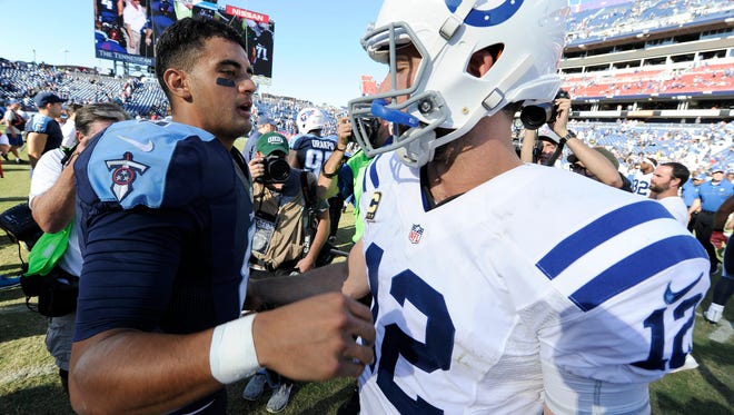 Titans quarterback Marcus Mariota (8) and Colts quarterback Andrew Luck (12) meet after the Titans' loss at Nissan Stadium on Oct. 23. The Titans are winless against Luck.