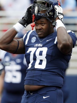Mississippi offensive linesman Laremy Tunsil (78) looks around during pre-game warmups prior to an NCAA college football game against Louisiana-Lafayette at Vaught-Hemingway Stadium in Oxford, Miss., Saturday, Sept. 13, 2014. (AP Photo/Rogelio V. Solis)