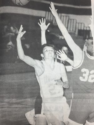 Union County Middle School forward Troy Meadows scores 2 of his 17 points in a 7th grade Indians game against the Cardinals in January 1991.