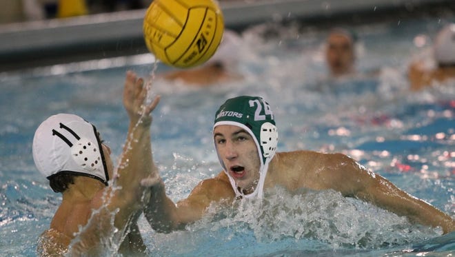 All-state player Adam Iaos (green cap) is on the attack for Sycamore in the pool.