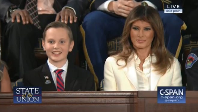 Preston Sharp sits next to First Lady Melania Trump during President Trump's State of the Union address Tuesday night.