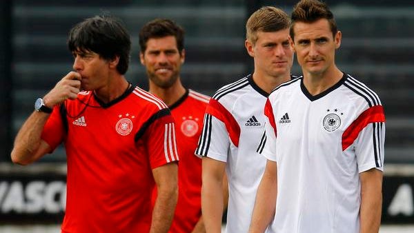 Germany coach Joachim Loew (left) conducts a training session with players Miroslav Klose (right) and Toni Kroos (second from right), the day before the 2014 World Cup final in Rio de Janeiro.