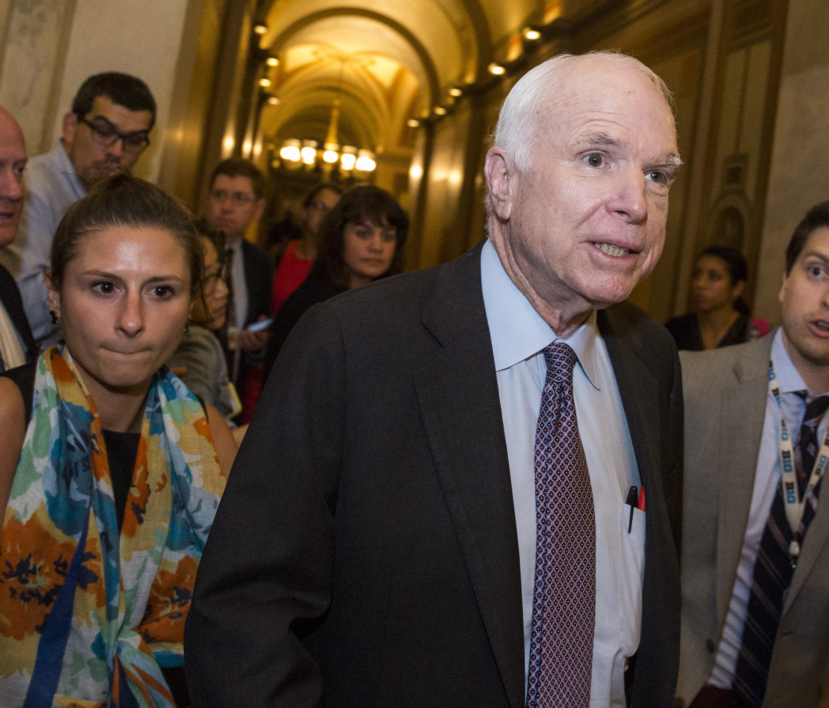 Sen. John McCain is pictured leaving the Senate Chamber after the Senate narrowly defeated a bill early Friday that would have repealed limited portions of the Affordable Care Act.