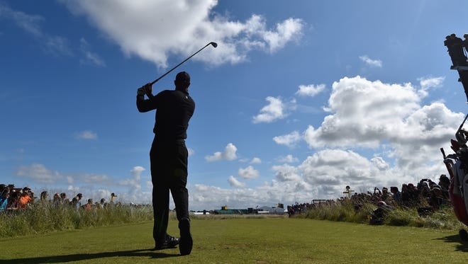 Tiger Woods of the United States tees off during a practice round prior to the start of The 143rd Open Championship at Royal Liverpool on July 15, 2014 in Hoylake, England.