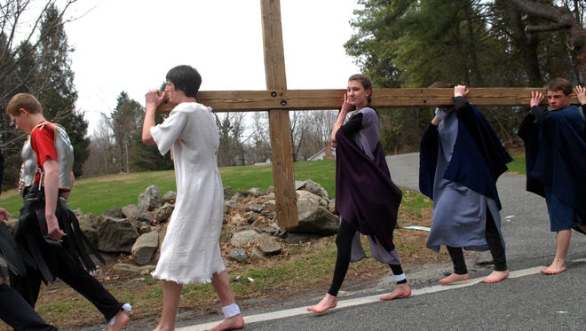The Christian Drama School at Rockaway Valley United Methodist Church reenacts the carrying of the cross on Good Friday.