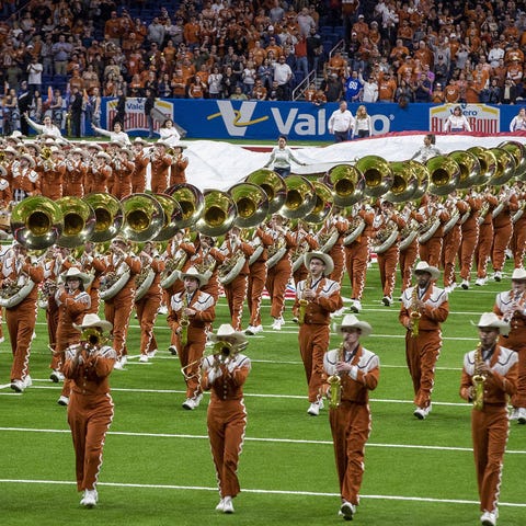 The Longhorn Band performs before the Alamo Bowl g