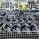 Air cleaner covers for automobile engines fill storage cages at MAHLE Wednesday.