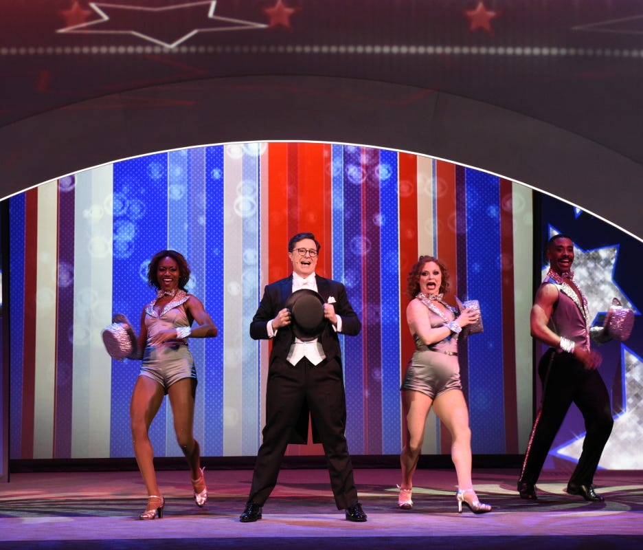Stephen Colbert performs a musical tribute for advertisers before laying into President Trump.