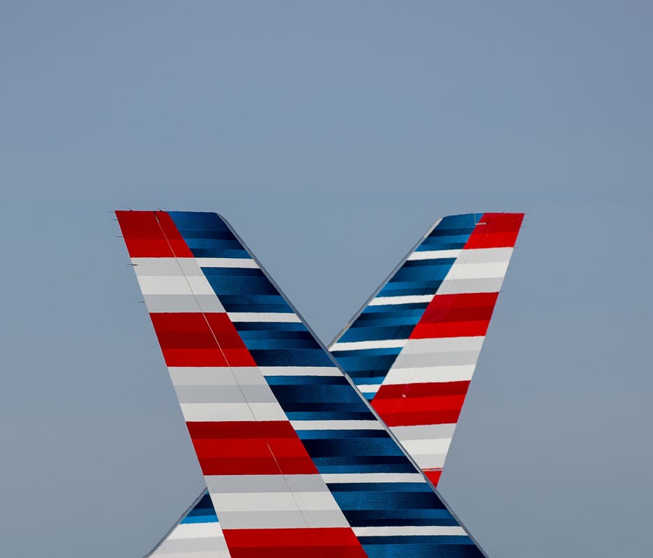 Two American Airlines Boeing 757s pass one another at Chicago O'Hare International Airport in June 2015.