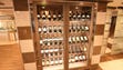 Refrigerated, glass-fronted wine cabinets line the