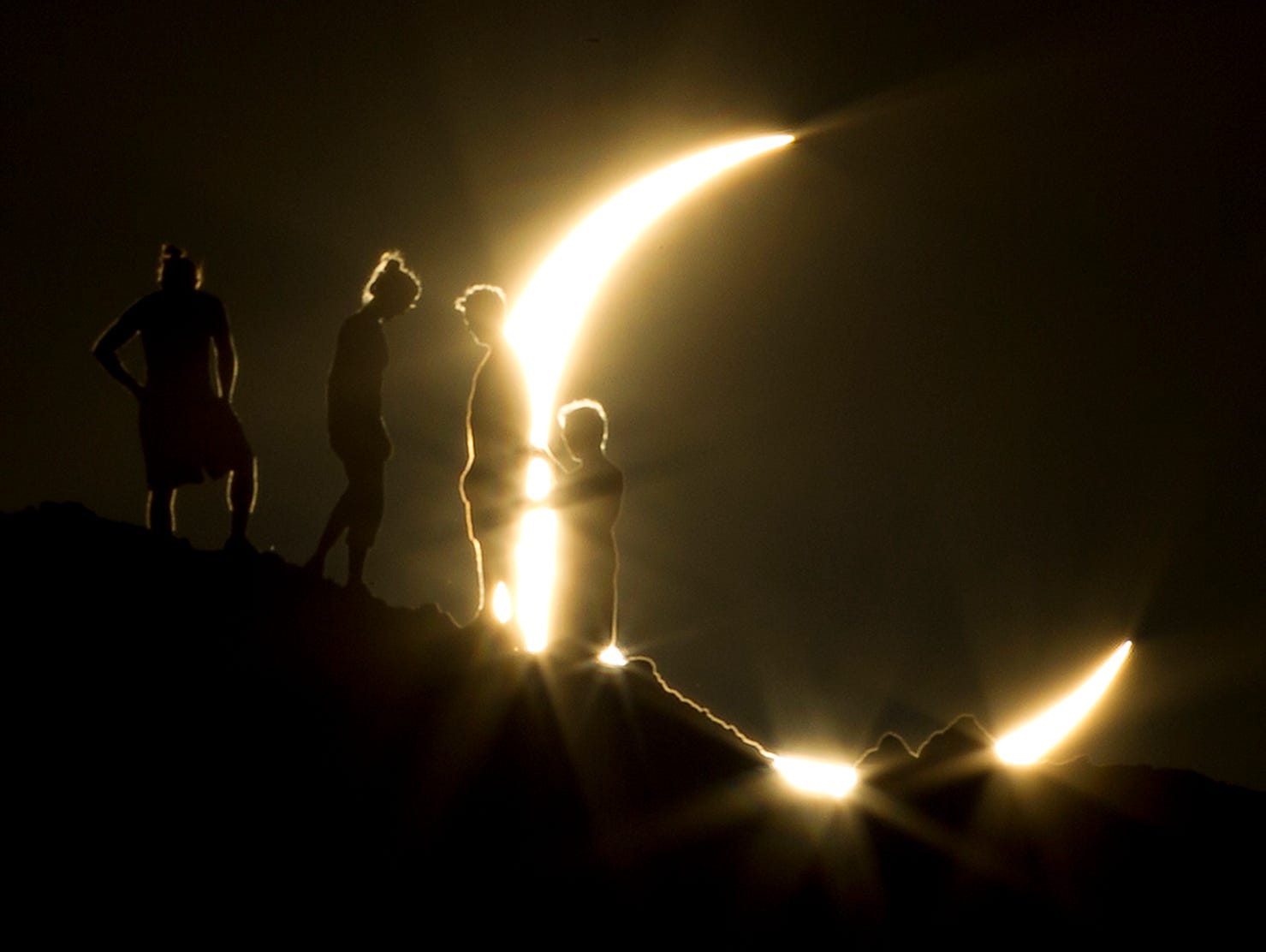 Hikers watched a partial solar eclipse in Phoenix in May 2012. The moon's silhouette blocked out about 83% of the sun's surface area in the area.