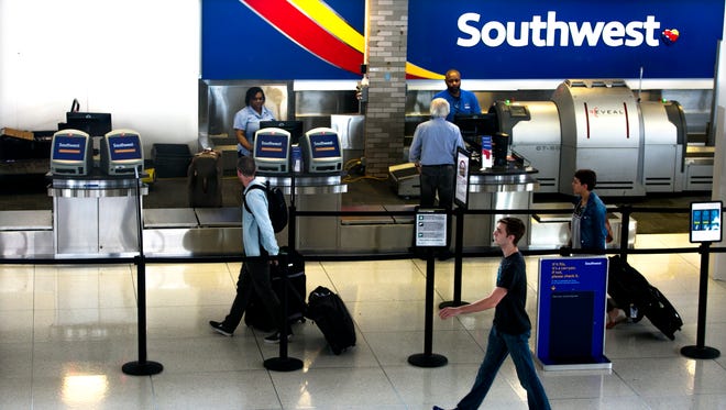 May 12, 2016 - Customers prepare to check-in at the Southwest counter at the Memphis International Airport.