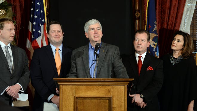 Gov. Rick Snyder announces a deal to fix Michigan's crumbling roads and bridges agreed to by legislative leaders from both parties. Joining Snyder for the announcement are House Minority Leader Tim Greimel, left, House Speaker Jase Bolger, Senate Majority Leader Randy Richardville, and Senate Minority Leader Gretchen Whitmer.
