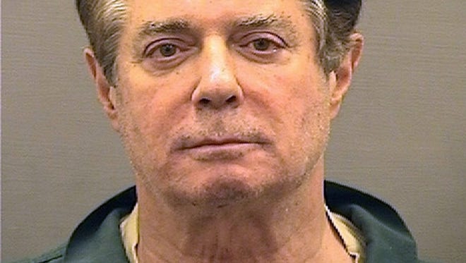 Paul Manafort poses for a mugshot photo at the Alexandria Detention Center in Alexandria, Virginia.