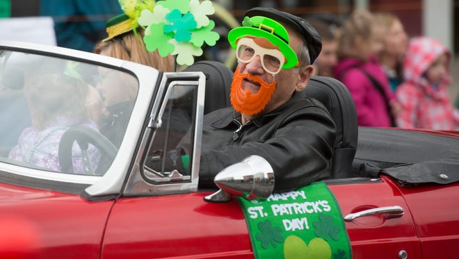 People line up to watch the Lucky Joe's St. Patrick's Day Parade in Old Town on Saturday, March 11, 2017. 