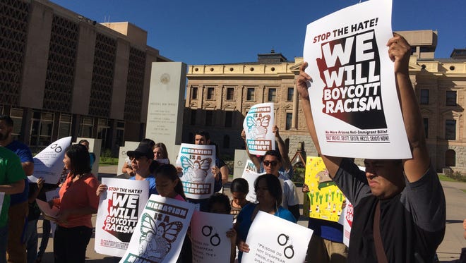 Protesters gathered in front of the state Capitol on Feb. 15, 2016, to rally against a bill that they say threatens to kill efforts to implement city IDs for immigrants.
