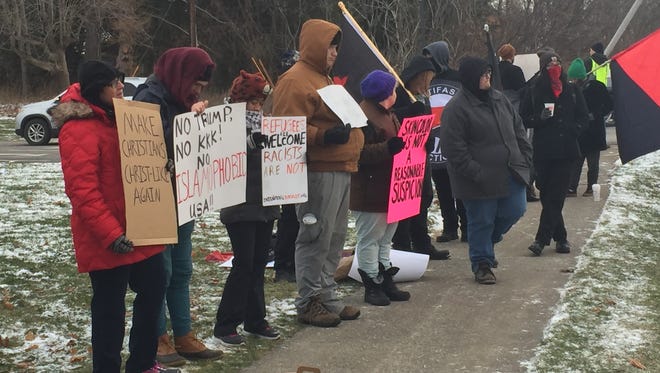 Protesters in front of Browncroft Community Church in Penfield on Dec. 11, 2016.