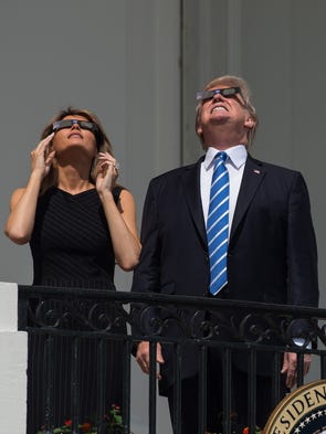 Melania Trump was wearing a black pin-striped sheath