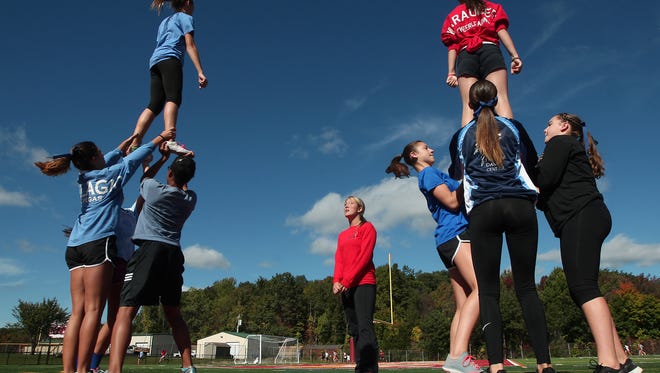 Morgan Lowrey, a 19-year-old Rutgers cheerleader who suffered a severe injury during a pyramid, now transitioning to coaching. She is helping out Mount Olive's junior varsity cheer squad while at Rutgers. October 6, 2015, Mount Olive, NJ.