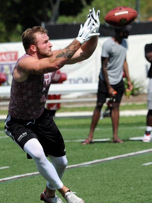Gabe Hughes runs drills for NFL scouts during Pro Day at Florida Tech.