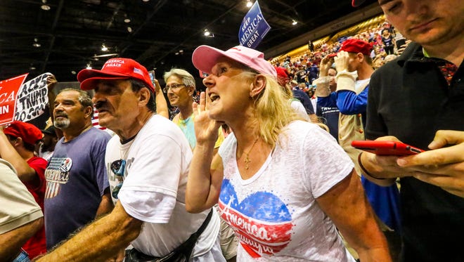 Supporters of President Donald Trump yell "Fake news" and other colorful language at CNN reporter Jim Acosta during Trump's July 31 Make America Great Again Rally at the Florida State Fairgrounds in Tampa.