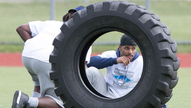 Lions running Ameer Abdullah talks with former Lions running back Joique Bell during the Calvin Johnson Jr. Foundation Catch a Dream football camp held at Southfield high school Saturday, May 20, 2017 in Southfield.