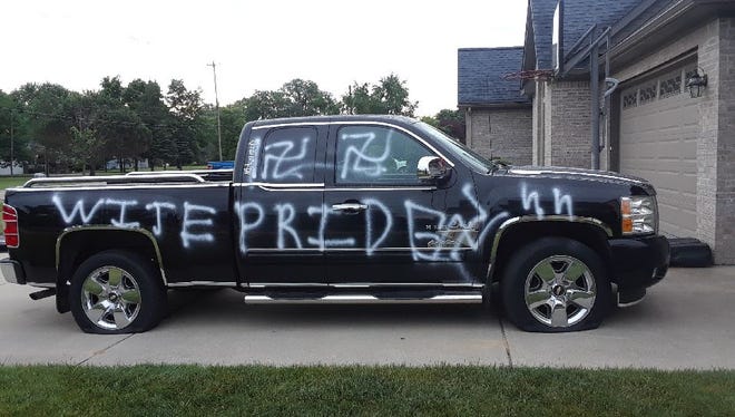 The words "WITE PRIDE" and swastikas painted on the passenger side of Hubert Roberts' truck.