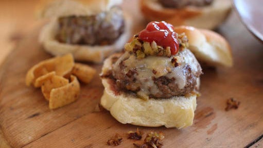 This Nov. 16, 2015 photo shows beer steamed cheese and mushroom beef sliders in Concord, New Hampshire. This dish is from a recipe by Sara Moulton.