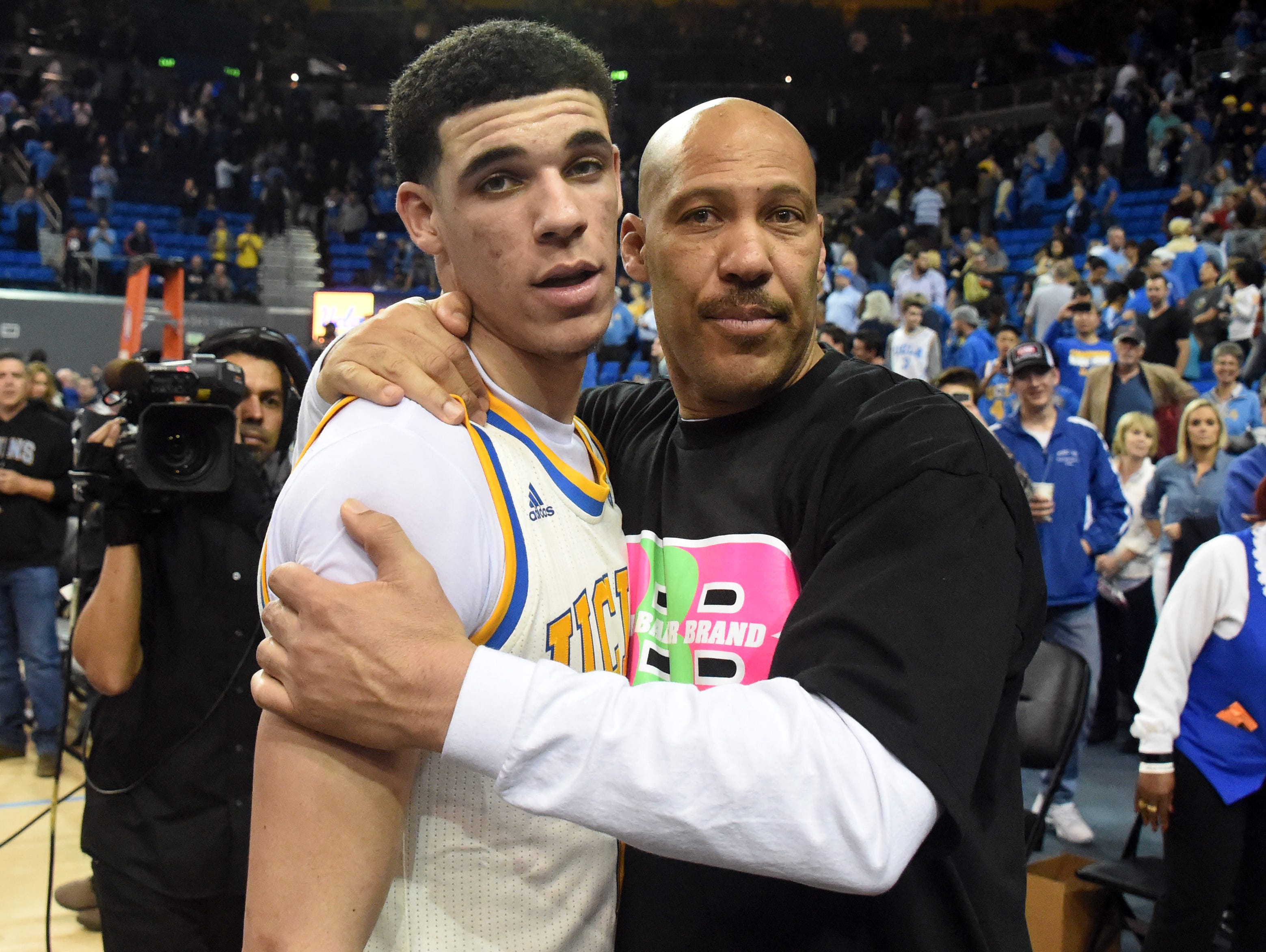 LaVar Ball, right, embraces his son, Lonzo, after a recent UCLA game at Pauley Pavilion.