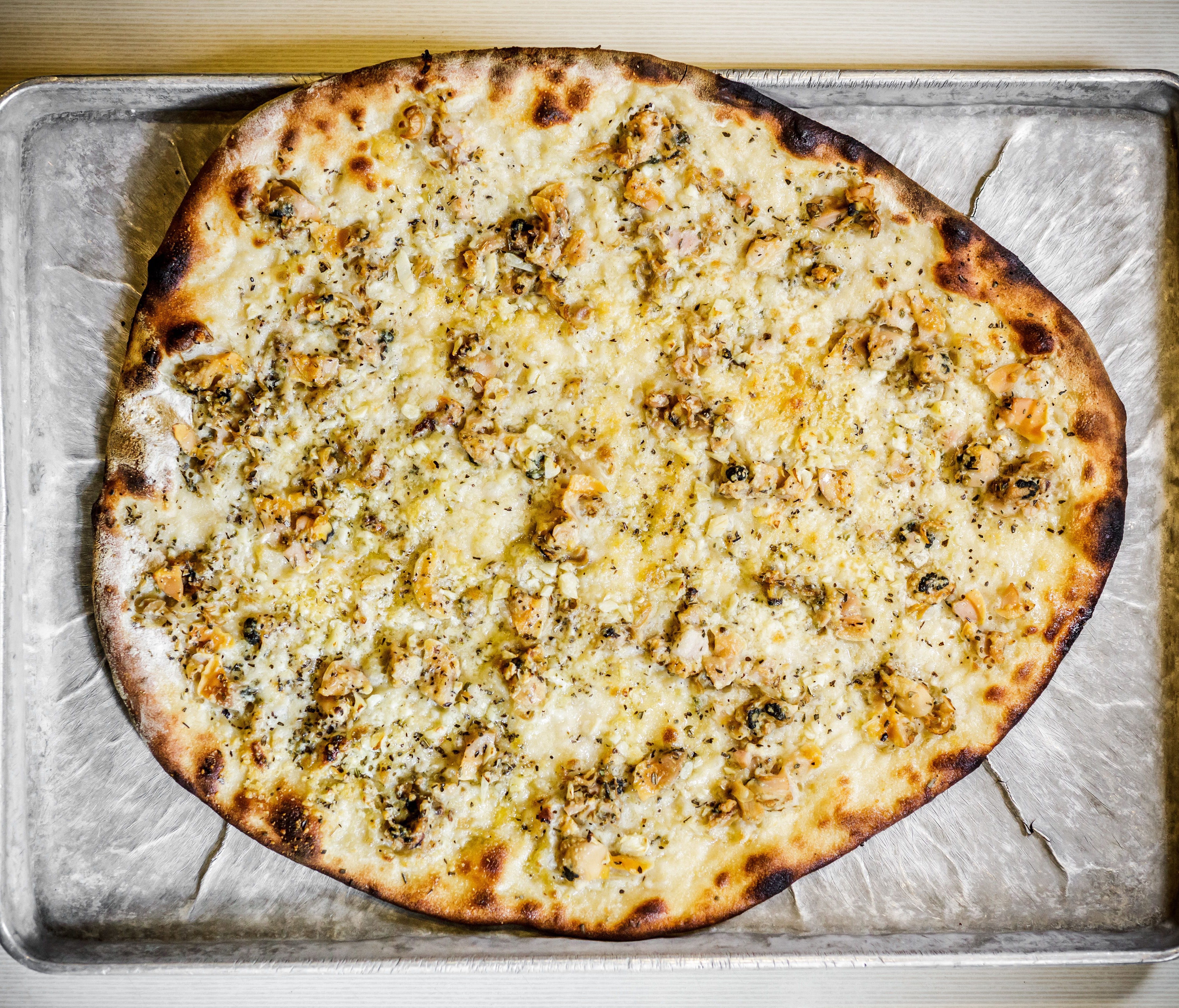 New Haven's signature white clam pizza was invented at Pepe's. While many have followed suit, Pepe's pie — a combination of fresh clams, grated cheese, olive oil, fresh garlic and oregano — is the undisputed champ.