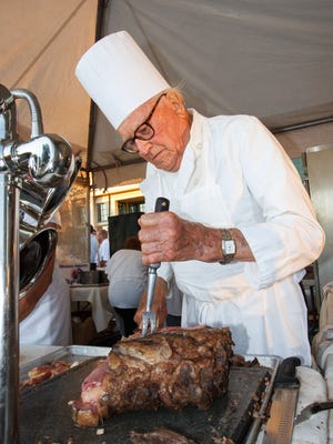Hans Weissgerber Sr. of the Golden Mast Restaurant carves up the prime rib for Weissgerber's prime rib sandwich during Taste of Lake Country in Pewaukee in 2015. Weissgerber died Oct. 10 at 100 years old.
