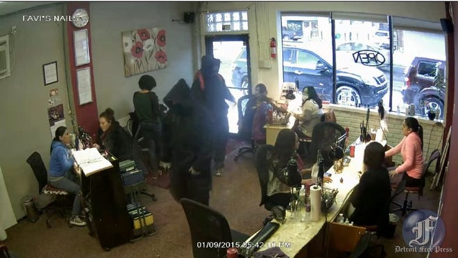 Two men enter a Detroit nail salon and soon begin robbing the patrons.