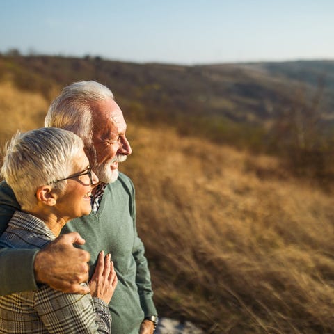 Elderly couple enjoying time together outdoors.